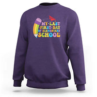 Purple crewneck sweatshirt with colorful back-to-school graphic on the chest