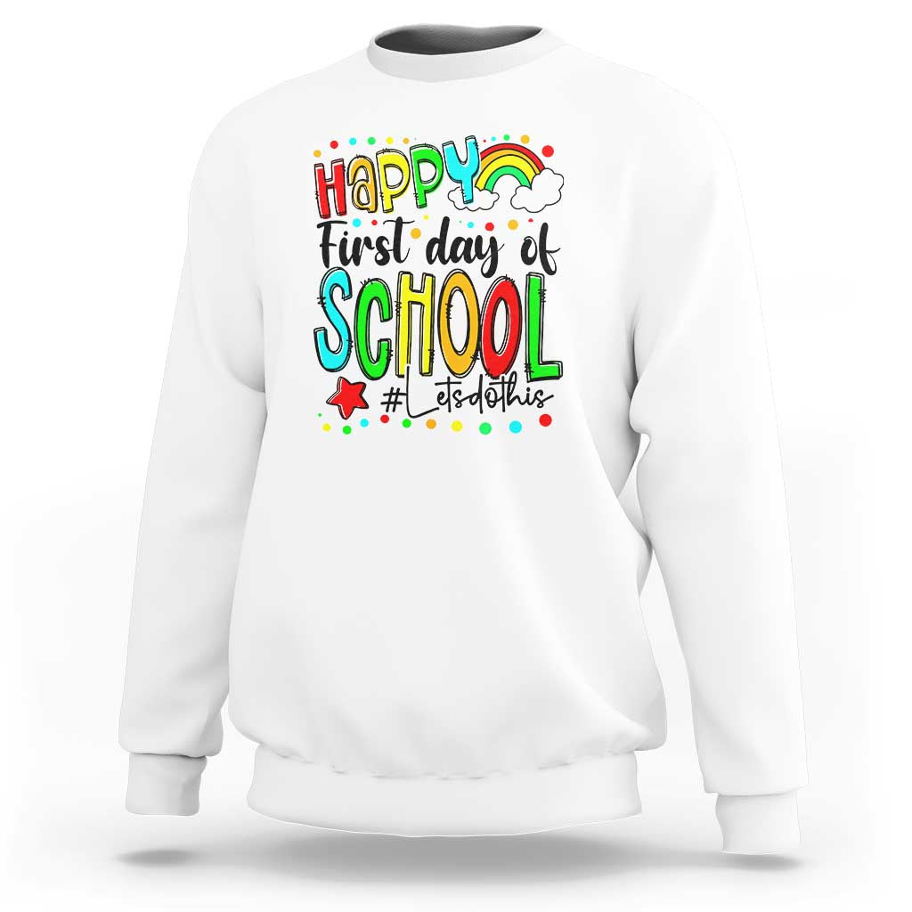 White sweatshirt with front “Happy First Day of School” rainbow graphic and text