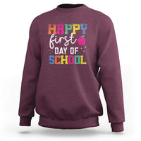Maroon sweatshirt with “Happy First Day of School” colorful text graphic on front