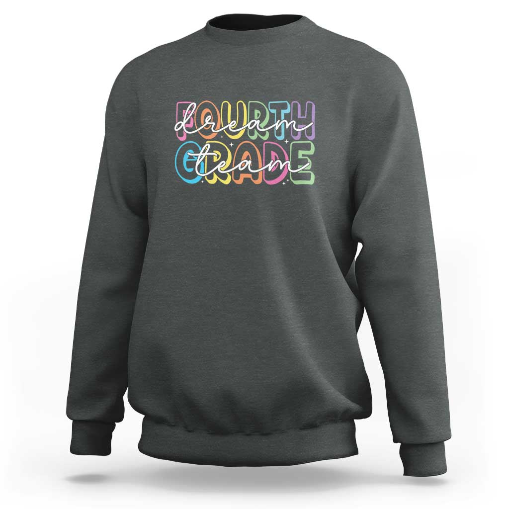 Dark heather gray sweatshirt with “Dream Team” graphic, crew neck and long sleeves