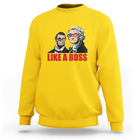 Daisy yellow sweatshirt with "LIKE A BOSS" graphic of two presidents