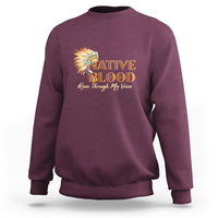 Maroon crewneck sweatshirt with Native Blood feather graphic on the front