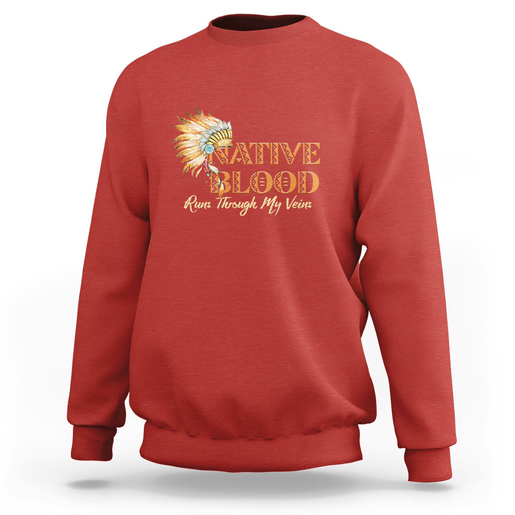 Red crewneck sweatshirt with Native Blood feather graphic on the front