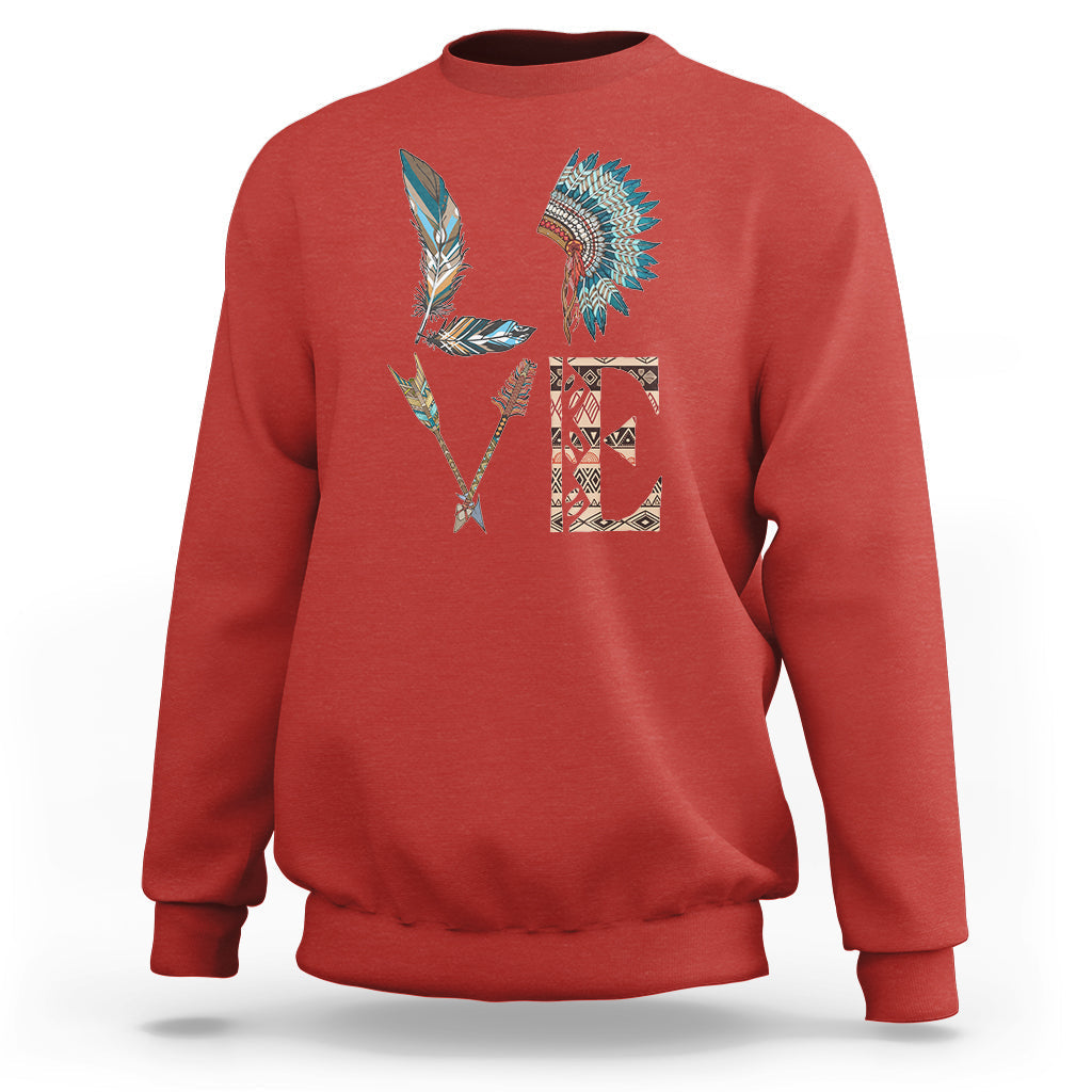 Native American sweatshirt in red with colorful feather tribal graphic on back