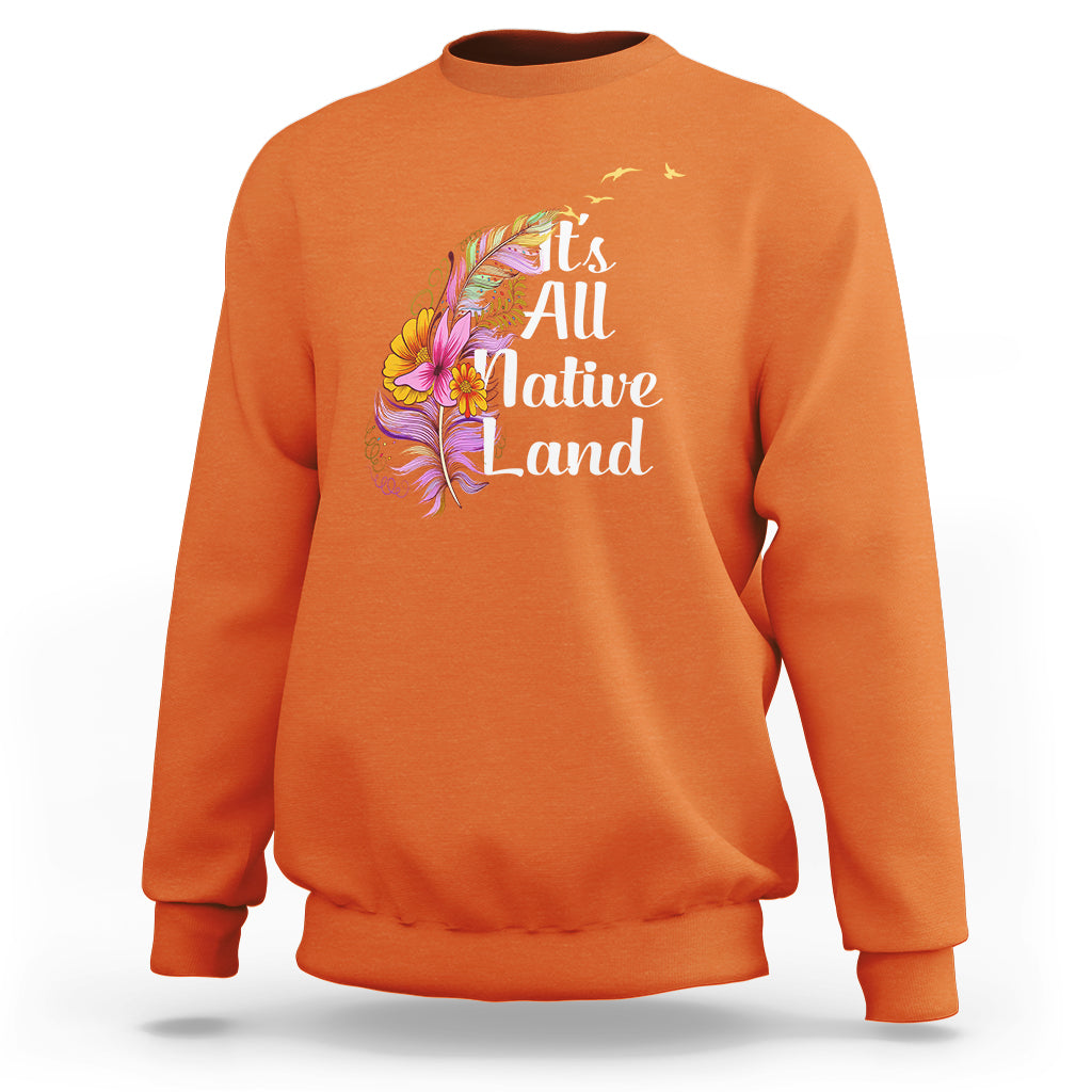 Orange Native American sweatshirt with 'It's All Native Land' feather graphic