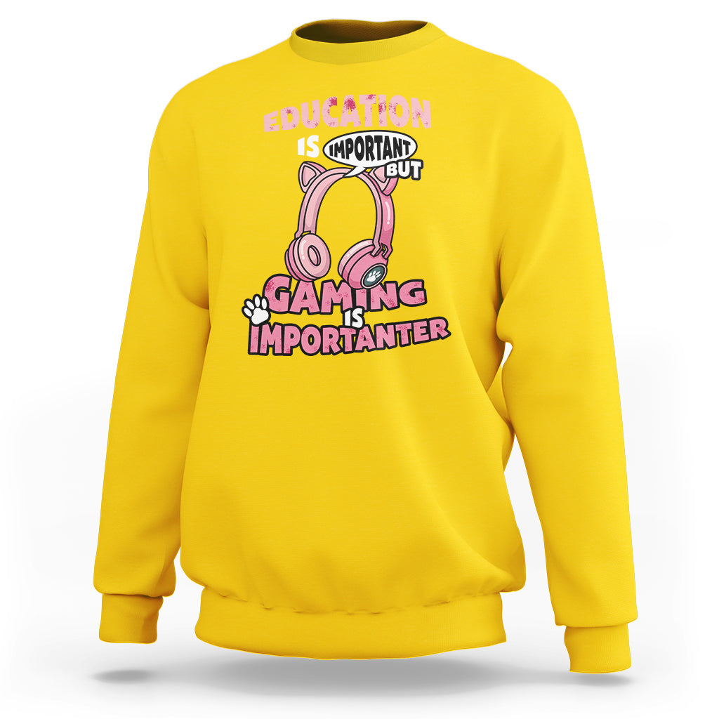 Daisy yellow crewneck sweatshirt with pink gaming-themed graphic text, front view