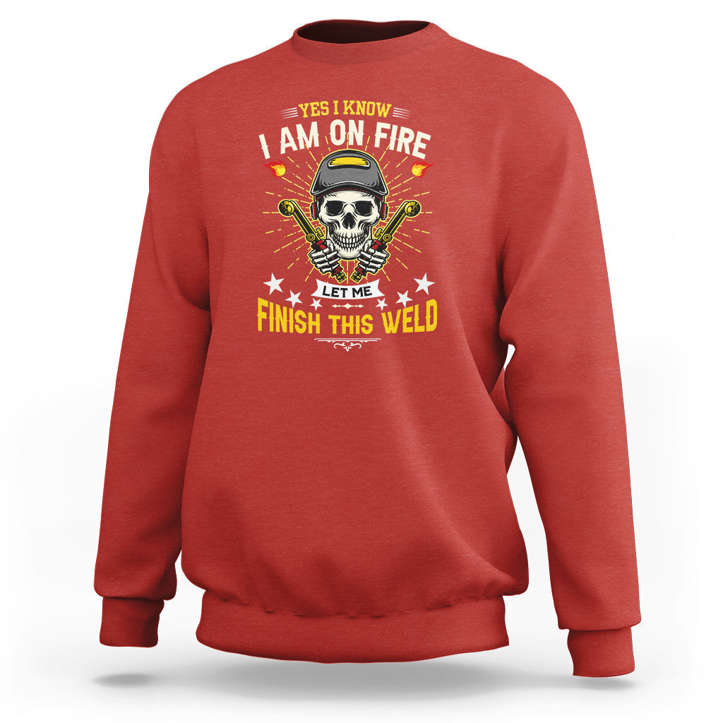 Red crewneck sweatshirt with skull welding graphic and “Finish this weld” slogan