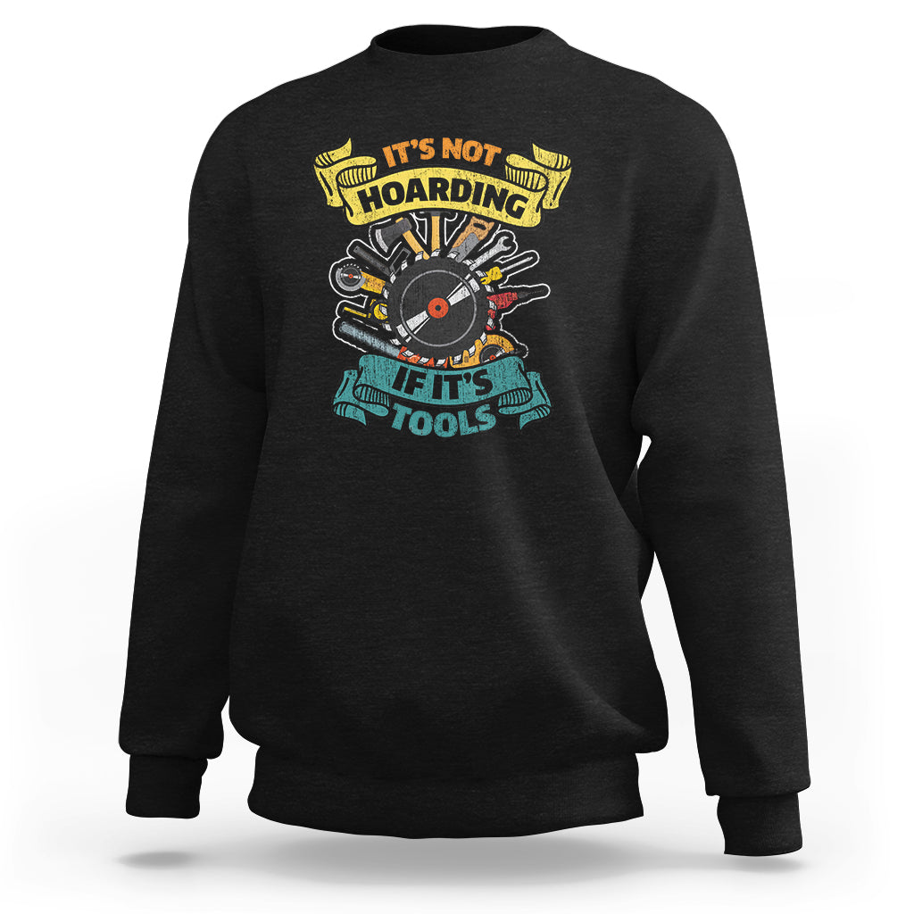 Black sweatshirt with multicolor woodworker tools graphic on the chest