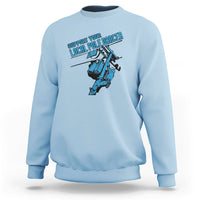 Light blue crewneck sweatshirt with front pole dancer lineman graphic