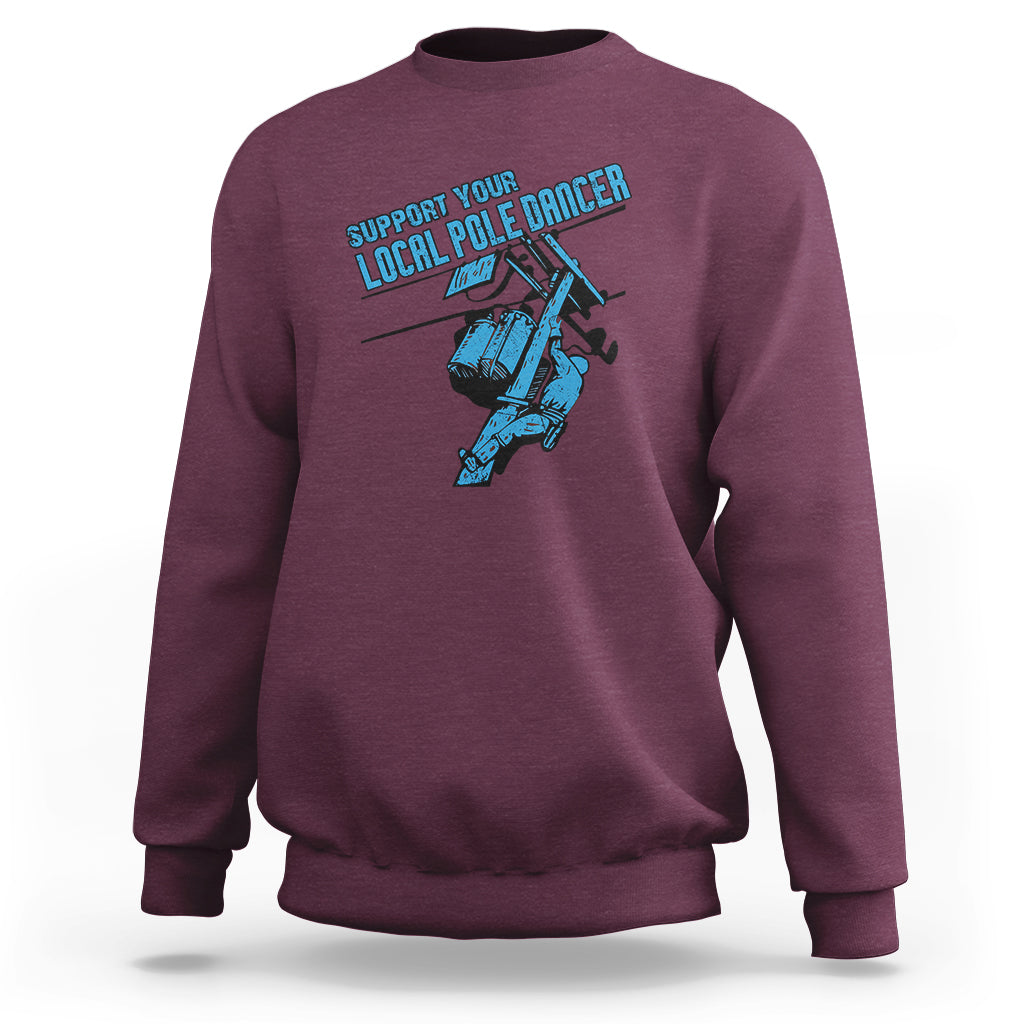 Maroon crewneck sweatshirt with front pole dancer lineman graphic