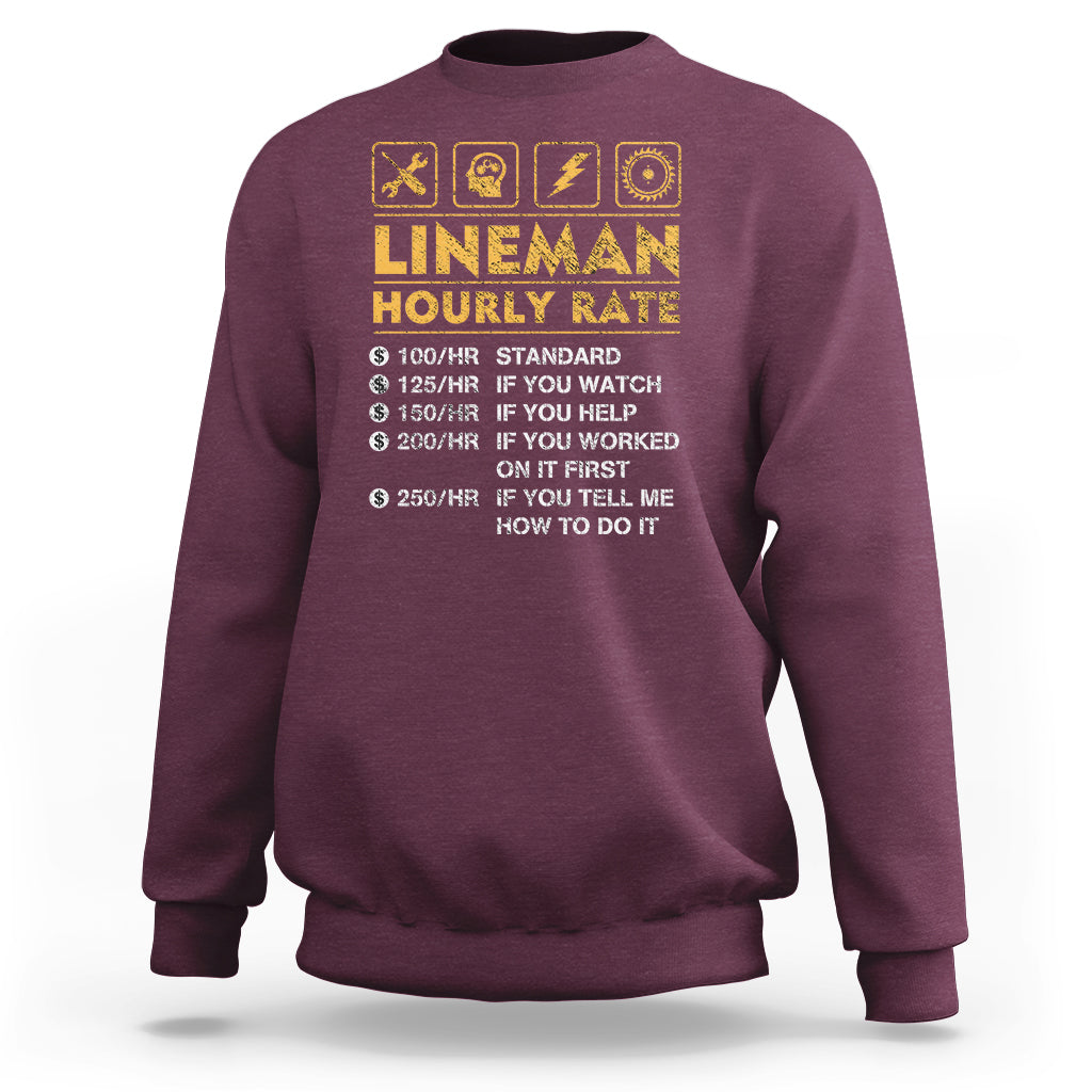 Maroon sweatshirt with “LINEMAN HOURLY RATE” front graphic and small icon symbols