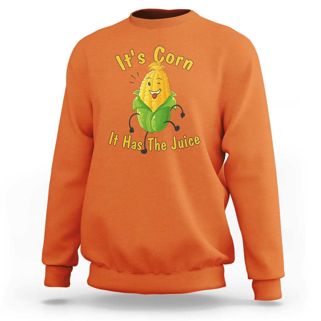 Orange sweatshirt with “It’s Corn” corn character graphic and yellow slogan text