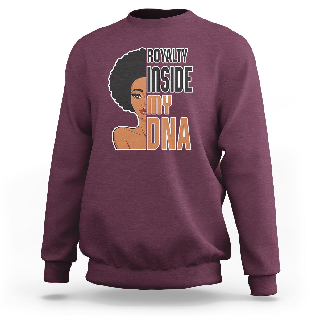 Women’s maroon crewneck sweatshirt with 'Royalty Inside My DNA' front graphic