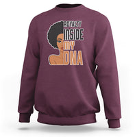 Women’s maroon crewneck sweatshirt with 'Royalty Inside My DNA' front graphic