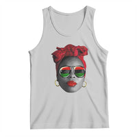 Light gray tank top with face graphic, red bow, green sunglasses, hoop earrings