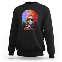 Women’s black crewneck sweatshirt with colorful afro portrait graphic on front.