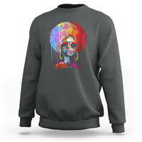 Women’s dark heather gray crewneck sweatshirt with colorful afro portrait graphic on front.