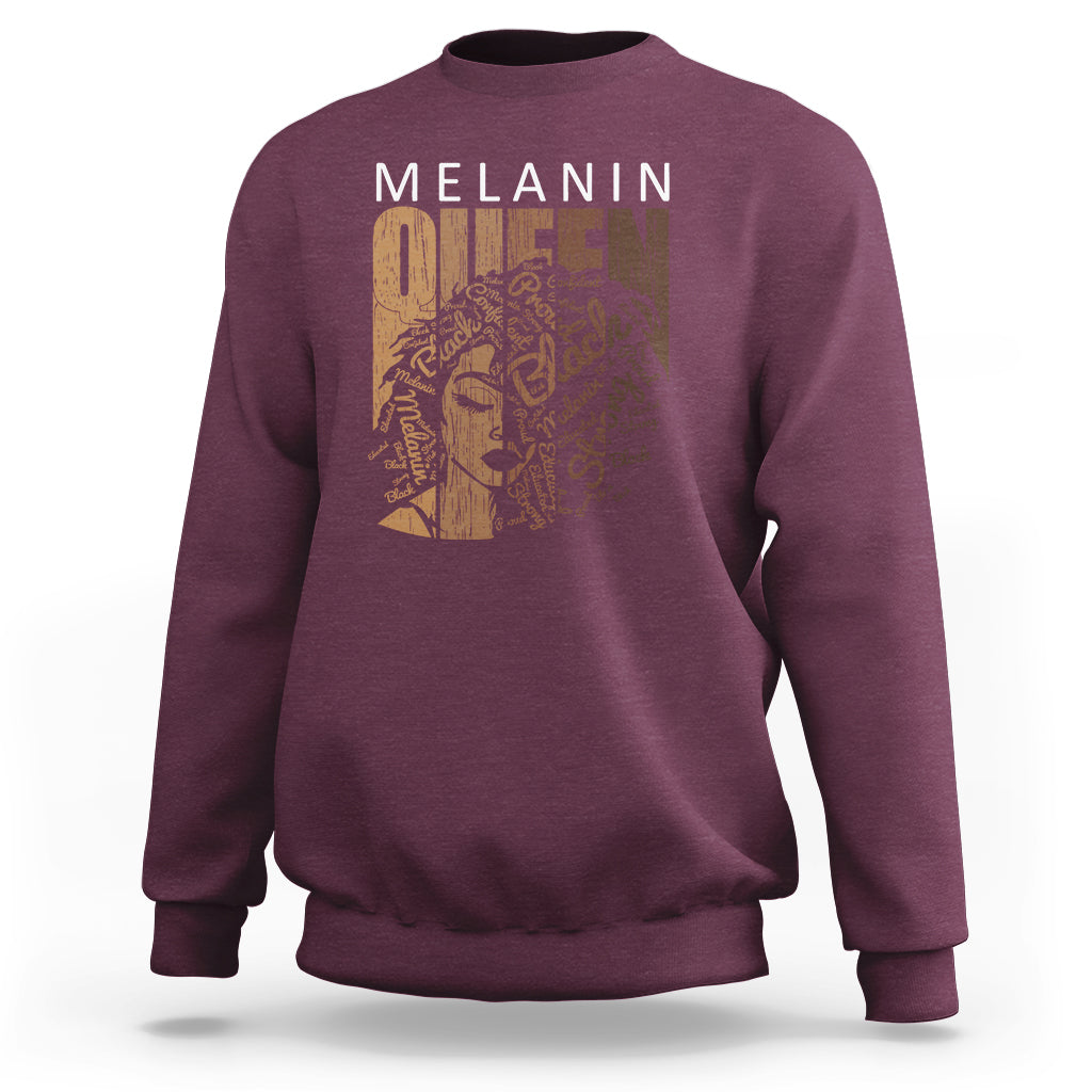 Maroon crewneck sweatshirt with front graphic and long sleeves