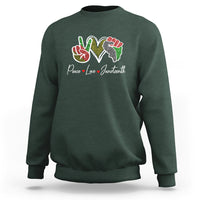 Dark forest green Juneteenth sweatshirt with colorful peace-love graphic on chest