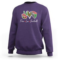 Purple Juneteenth sweatshirt with colorful peace-love graphic on chest