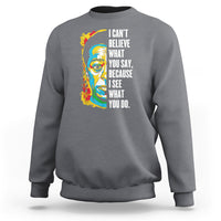 Charcoal crewneck sweatshirt with colorful portrait graphic and quote on front