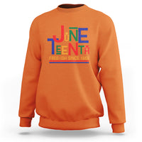 Orange crewneck sweatshirt with multicolor Juneteenth graphic, 'FREE-ISH SINCE 1865'
