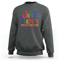 Charcoal crewneck sweatshirt with retro Juneteenth graphic and “FREE-ISH SINCE 1865”.