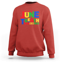 Red Juneteenth sweatshirt with front “JUNE TEENTH” graphic text print.
