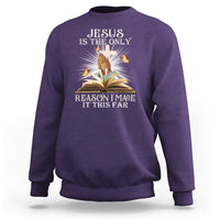 Purple Christian sweatshirt with front Jesus and open book graphic.