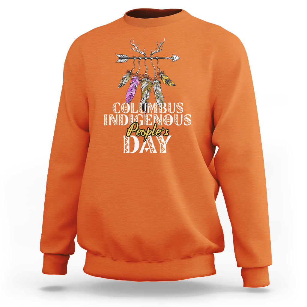 Orange crewneck sweatshirt with colorful feathered deer graphic and event text print