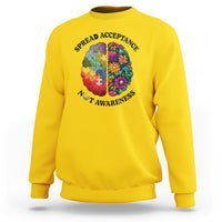 Yellow crewneck sweatshirt with colorful puzzle brain heart graphic
