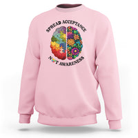 Light pink crewneck sweatshirt with colorful puzzle brain heart graphic