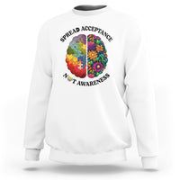 White crewneck sweatshirt with colorful puzzle brain heart graphic