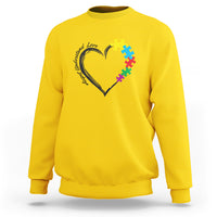 Daisy yellow autism awareness sweatshirt with heart-and-puzzle graphic on chest.