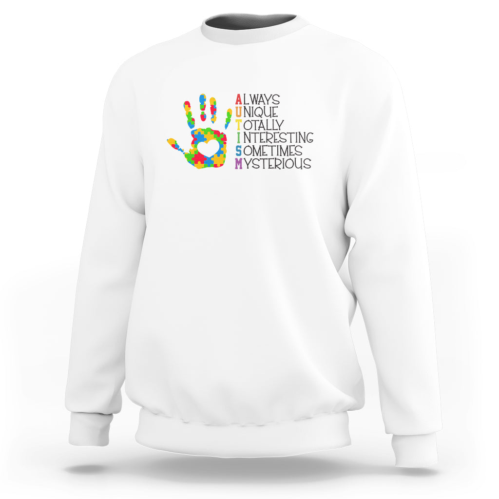 White autism definition sweatshirt with multicolor puzzle hand graphic and text