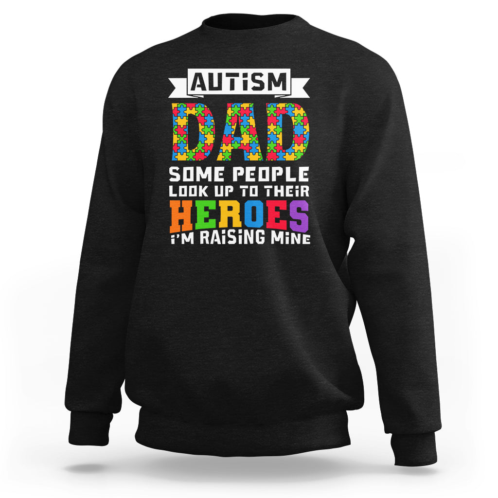 Black autism dad sweatshirt with colorful 'DAD' and 'HEROES' puzzle-piece graphic