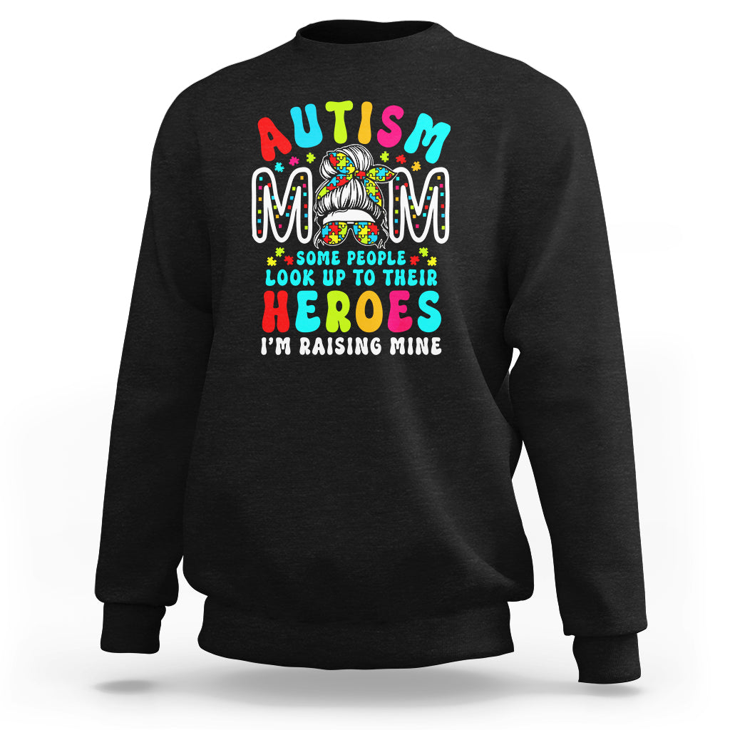Black crewneck sweatshirt with colorful Autism mom graphic on the chest