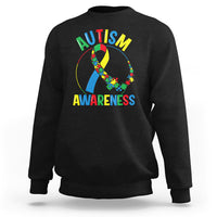 Black autism awareness sweatshirt with multicolor puzzle ribbon graphic and yellow text