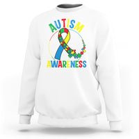 White autism awareness sweatshirt with multicolor puzzle ribbon graphic on front