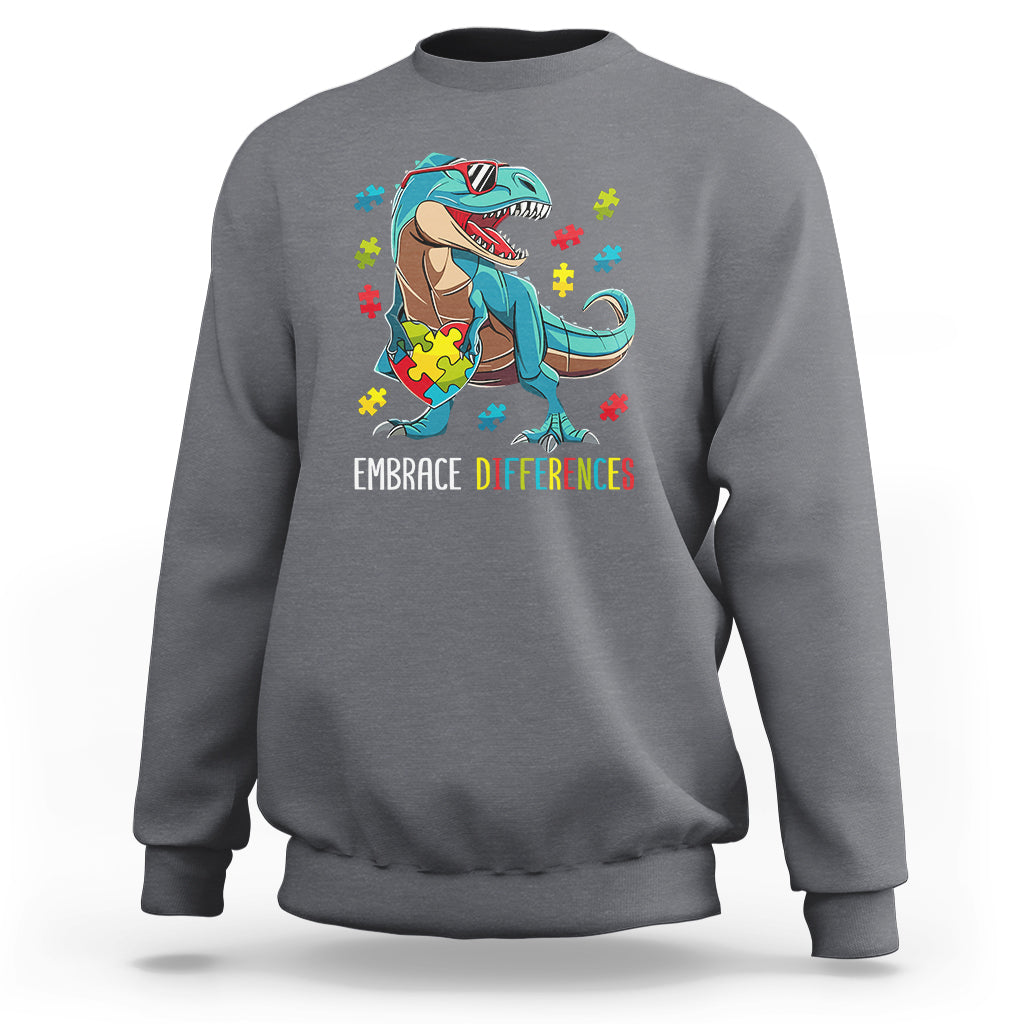 Gray sweatshirt with dinosaur puzzle heart graphic and "Embrace Differences" print