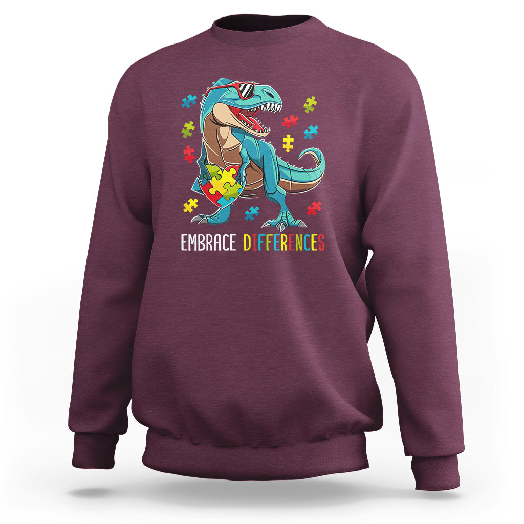Maroon sweatshirt with dinosaur puzzle heart graphic and "Embrace Differences" print