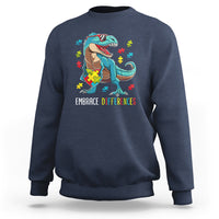 Navy sweatshirt with dinosaur puzzle heart graphic and "Embrace Differences" print