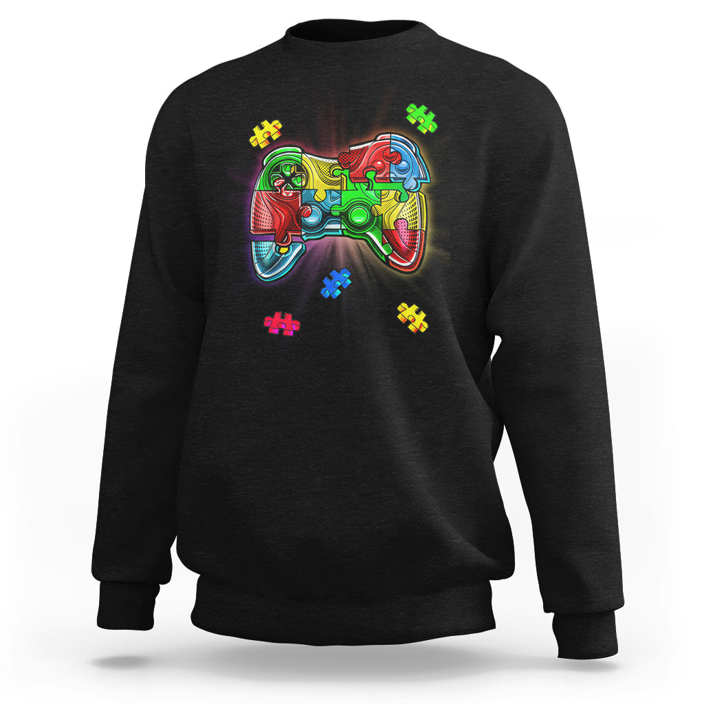 Black crewneck sweatshirt with colorful game controller autism puzzle graphic