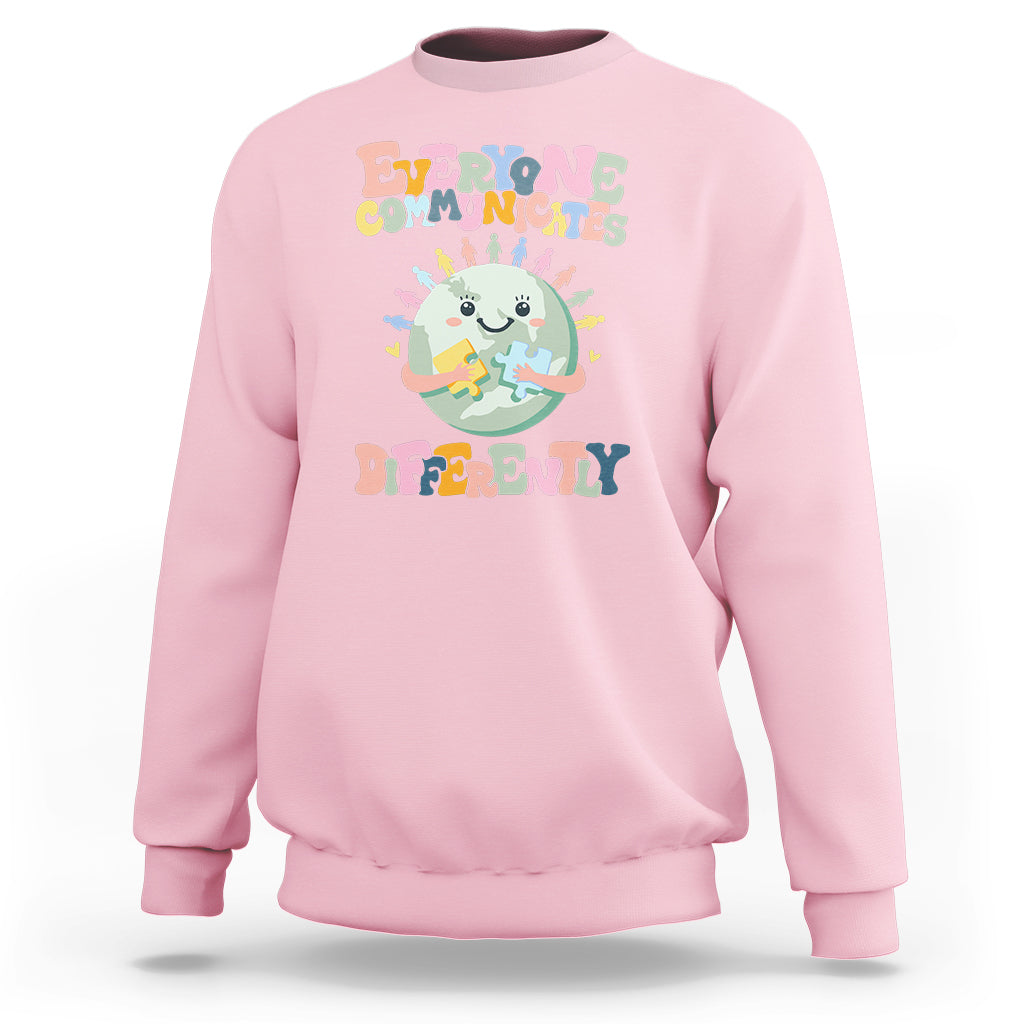 Light pink crewneck sweatshirt with autism acceptance graphic, long sleeves