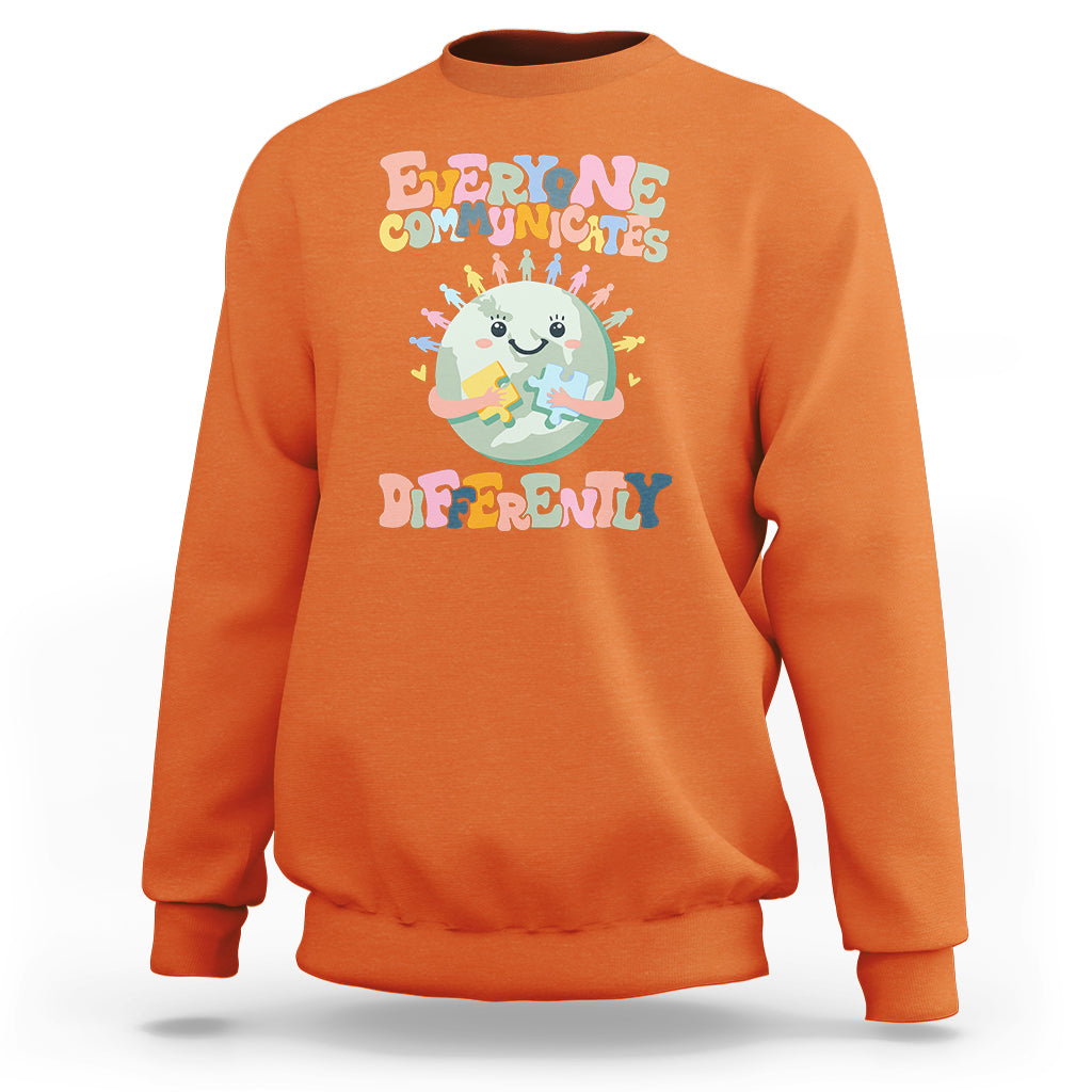 Orange crewneck sweatshirt with autism acceptance graphic, long sleeves