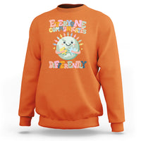 Orange crewneck sweatshirt with autism acceptance graphic, long sleeves