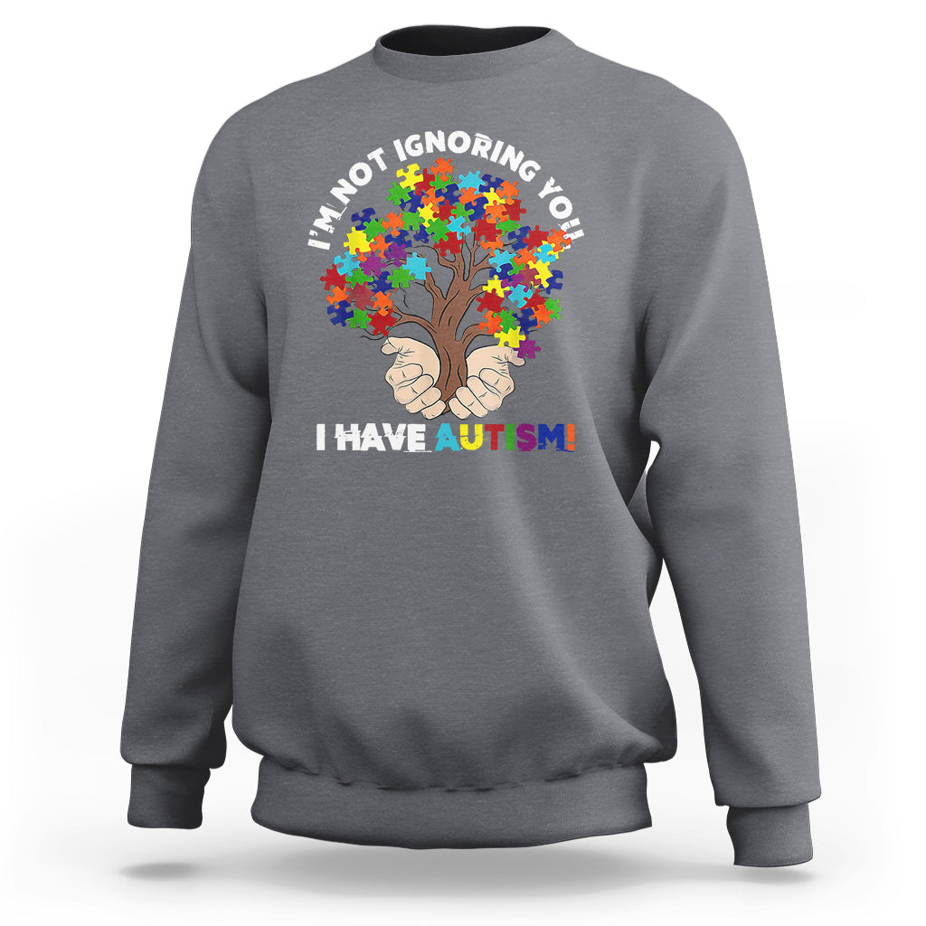 Dark heather gray crewneck sweatshirt with autism puzzle tree graphic and slogan 'I HAVE AUTISM!'