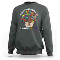 Charcoal gray crewneck sweatshirt with autism puzzle tree graphic and slogan 'I HAVE AUTISM!'