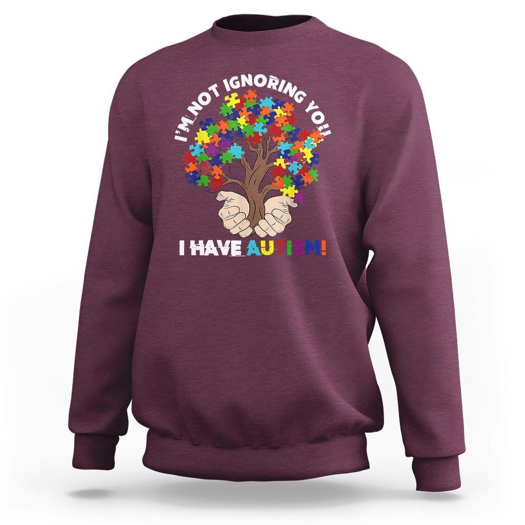 Maroon crewneck sweatshirt with autism puzzle tree graphic and slogan 'I HAVE AUTISM!'