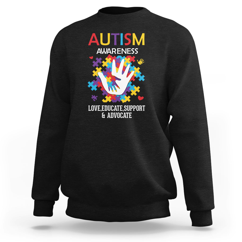 Autism awareness sweatshirt, black crewneck with colorful puzzle-hand graphic and text